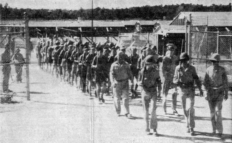 Prisoners being escorted to farm work